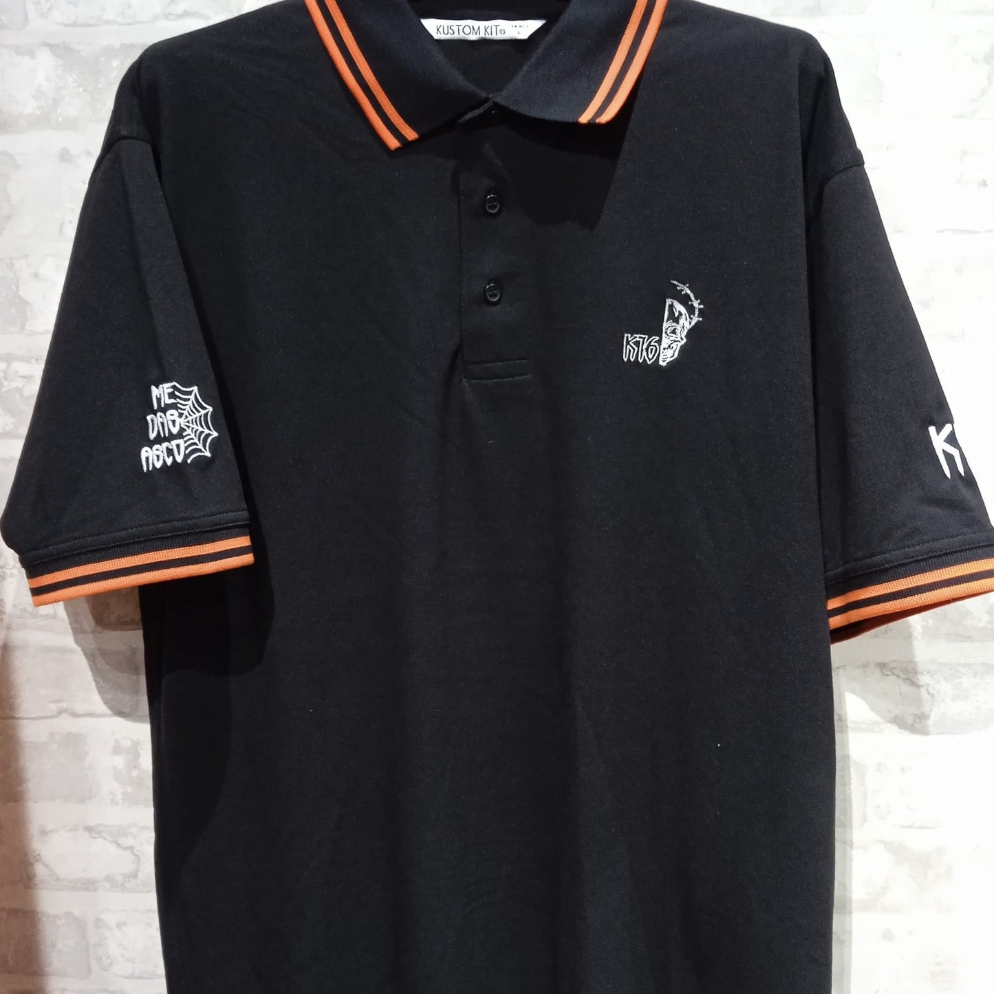 K16 - Polo Negro/Naranja